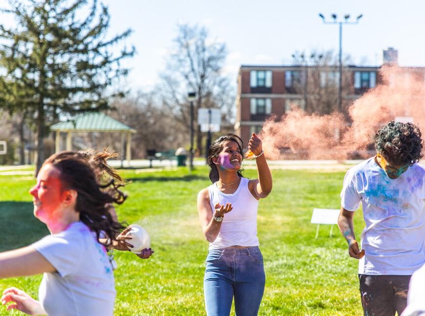 Students throwing color at each other for the HOLI Festival. 